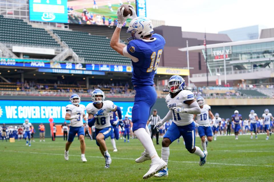 South Dakota State wide receiver Griffin Wilde (18) catches a pass to score a touchdown during the first half of an NCAA college football game against Drake, Saturday, Sept. 16, 2023, in Minneapolis. (AP Photo/Abbie Parr)
