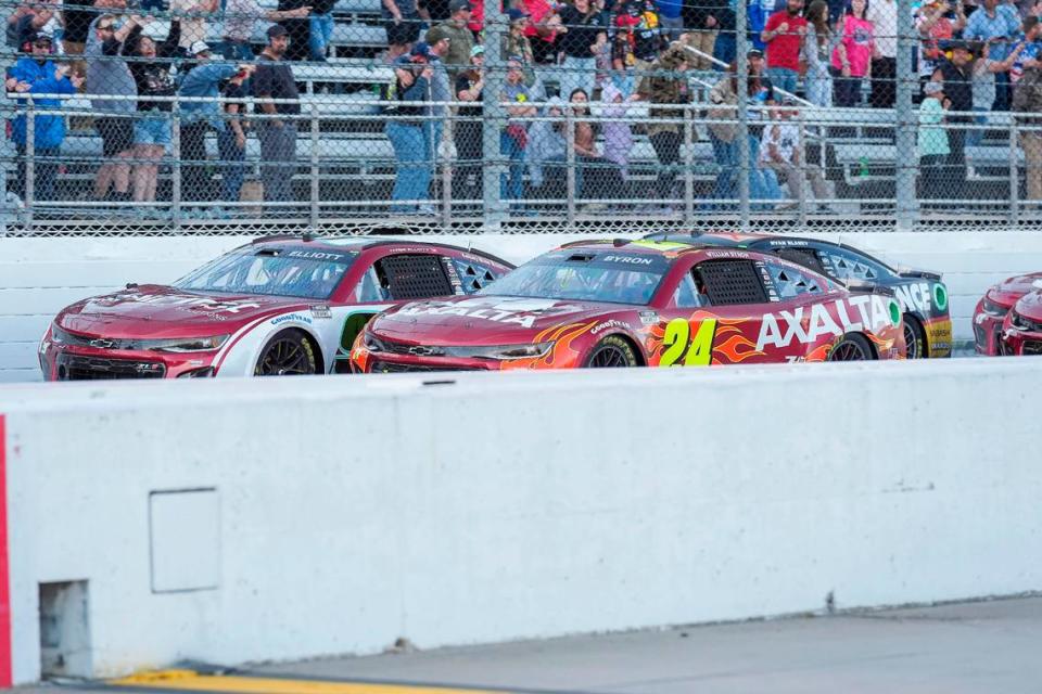 Apr 7, 2024; Martinsville, Virginia, USA; NASCAR Cup Series driver William Byron (24) and driver Chase Elliott (9) at the late restart during the Cook Out 400 at Martinsville Speedway. Jim Dedmon/USA TODAY Sports