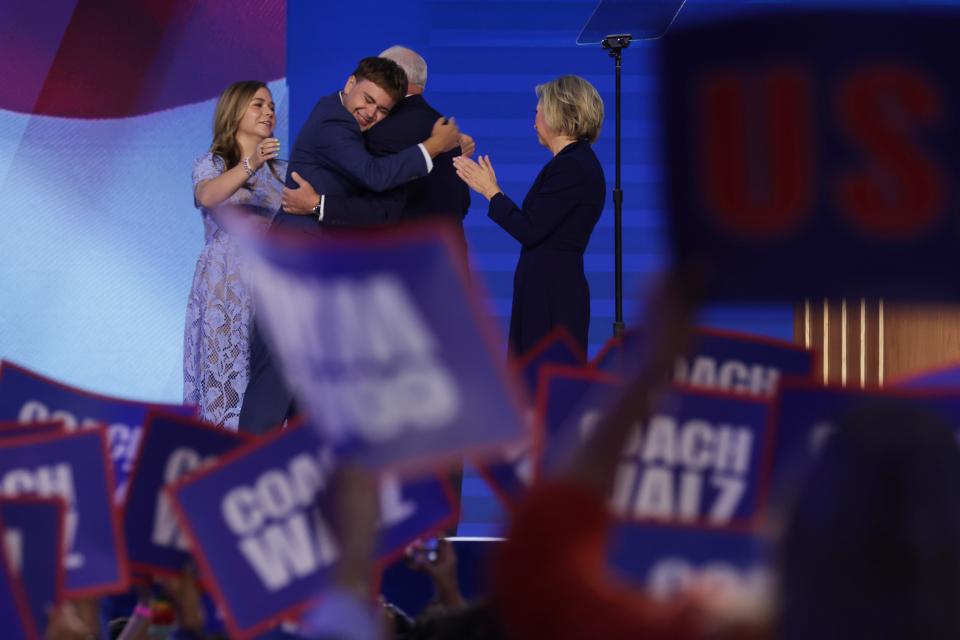 Democratic vice presidential nominee Minnesota Governor Tim Walz celebrates with his son Gus Walz (CL), wife Gwen Walz (R) and daughter Hope Walz (L) after accepting the Democratic vice presidential nominee onstage during the third day of the Democratic National Convention at the United Center on August 21, 2024 in Chicago, Illinois. Democratic Party delegates, politicians and supporters are in Chicago for the convention, which will culminate with current Vice President Kamala Harris accepting her party's presidential nominee. The DNC takes place August 19-22. (Photo by Alex Wong/Getty Images)