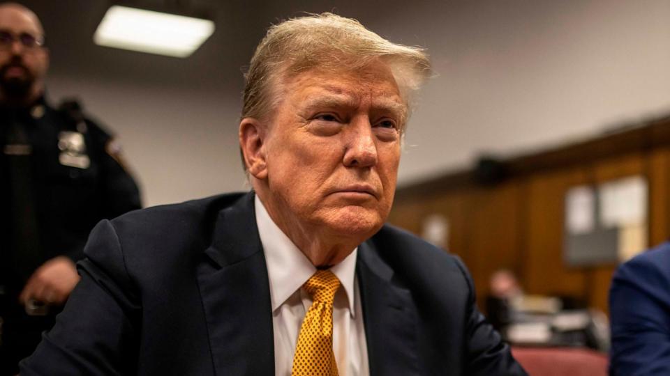 PHOTO: Former President Donald Trump sits in a courtroom next to his lawyer Todd Blanche, right, before the start of the day's proceedings in the Manhattan Criminal court, May 21, 2024, in New York.  (Dave Sanders/The New York Times via AP, Pool)