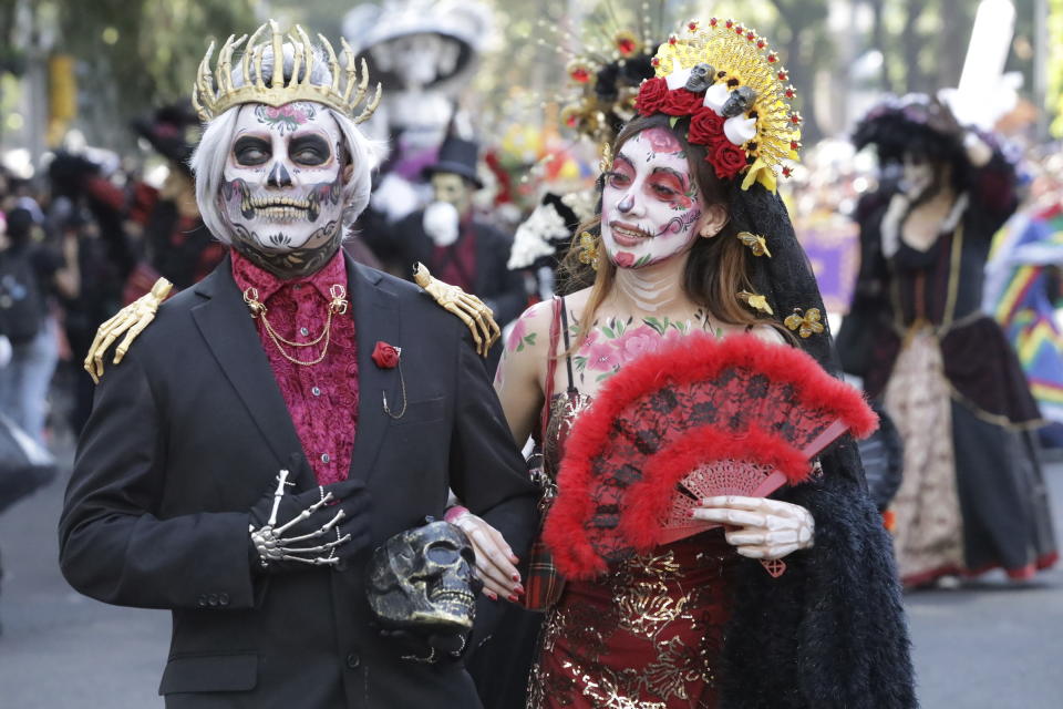 Participants take part in a James Bond-inspired Day of the Dead Parade, in Mexico City, Saturday, Nov. 4, 2023. The Hollywood-style parade was adopted in 2016 by Mexico City to mimic a fictitious march in the 2015 James Bond movie “Spectre.” (AP Photo/Ginnette Riquelme)