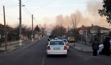 Smoke rises after a cargo train derailed and exploded in the village of Hitrino, Bulgaria, December 10, 2016. Bulphoto Agency/via REUTERS