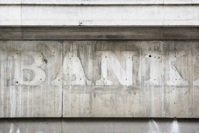 Image of faded sign on closed bank