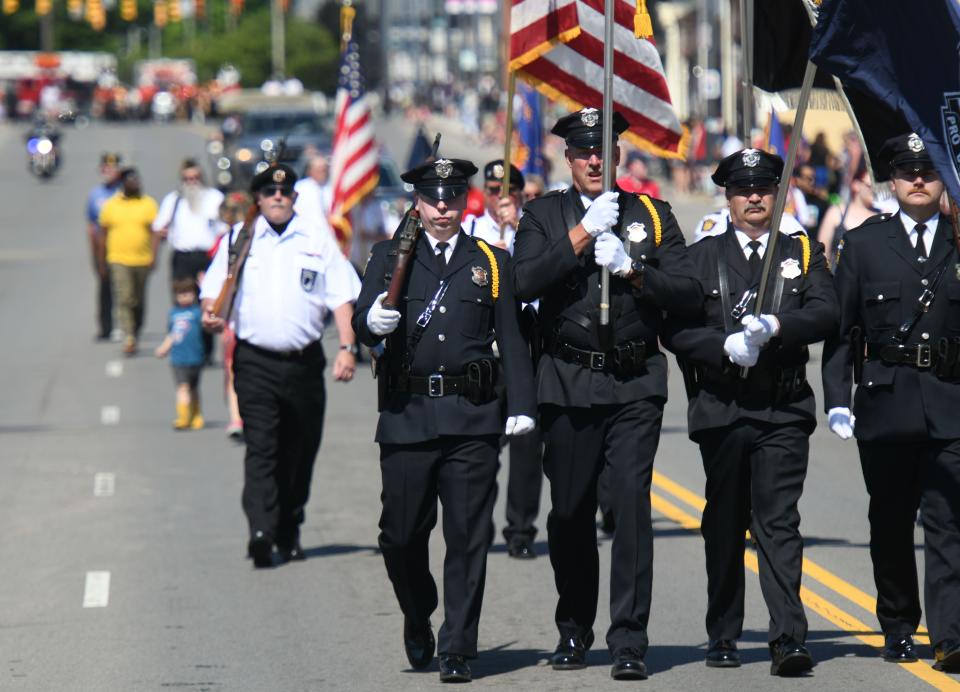 The Mansfield Police Department Color Guard leads the Memorial Day Parade in this past News Journal parade photo.