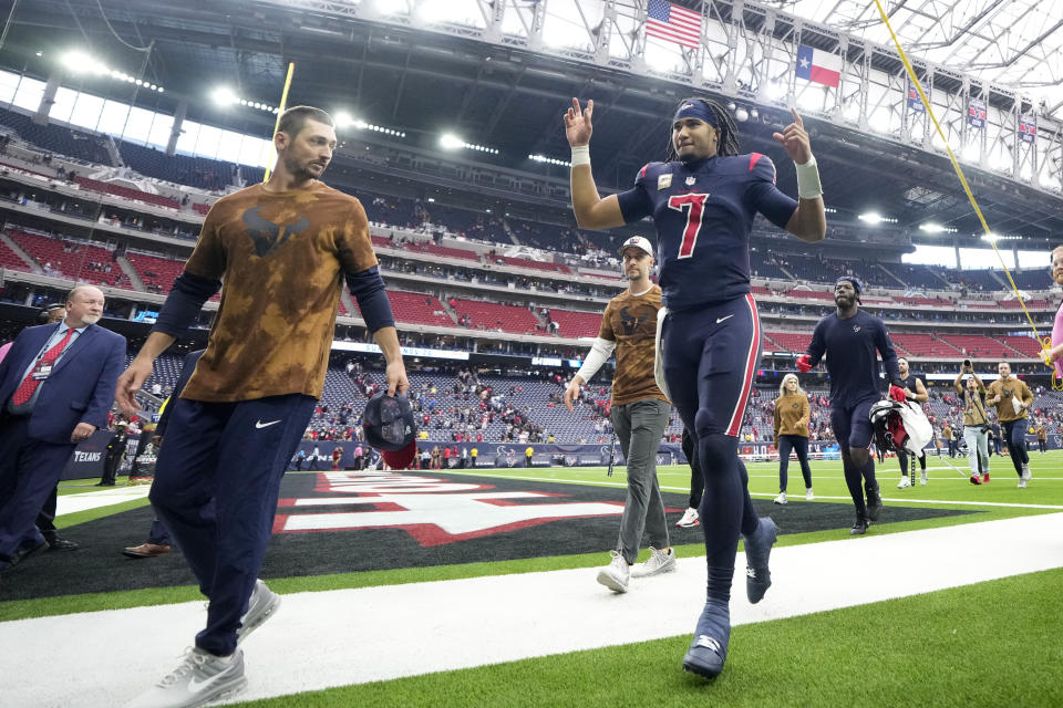 Houston Texans' C.J. Stroud (7) celebrates the team's win as he walks off the field after an NFL football game against the Arizona Cardinals in Houston, Sunday, Nov. 19, 2023. (AP Photo/David J. Phillip)