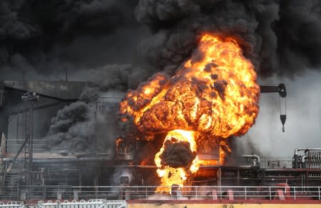 Fire from a vessel is seen at a port in Ulsan