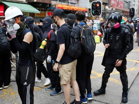 Ah Lung and other protesters are seen on the streets of Sham Shui Po during a protest in the neighbourhood, in Hong Kong