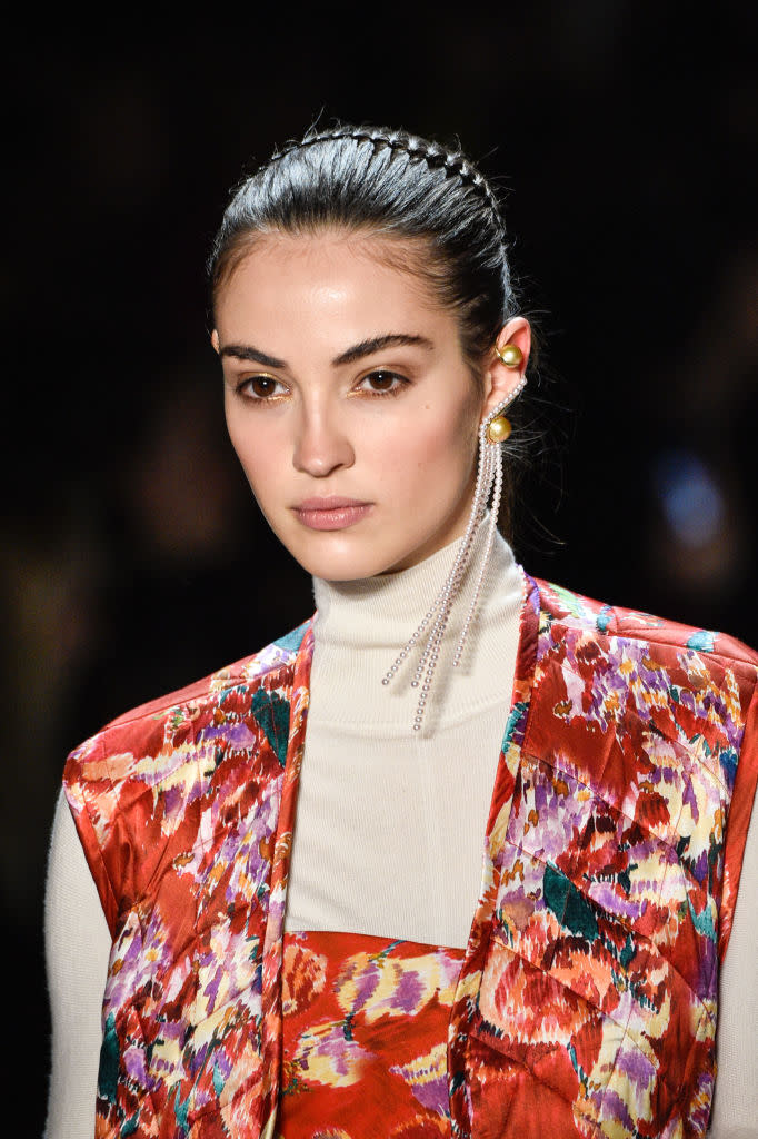 <p>Monocle gold and pearl strand earring at the Prabal Gurung FW18 show. (Photo: Getty) </p>