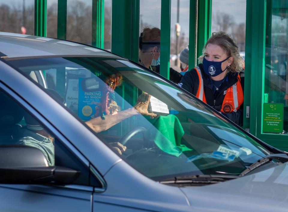 Audrey Kenny, Bucks County Director of Emergency Services hands out test kits as thousands of Bucks County residents waited in a fast-moving drive through line in the parking lot to receive free COVID-19 Rapid test kits Wednesday, January 19, 2022 at Sesame Place in Langhorne.