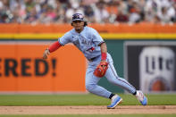 Toronto Blue Jays third baseman Santiago Espinal fields the grounder hit by Detroit Tigers' Spencer Torkelson and throws him out at first during the fourth inning of a baseball game, Saturday, June 11, 2022, in Detroit. (AP Photo/Carlos Osorio)