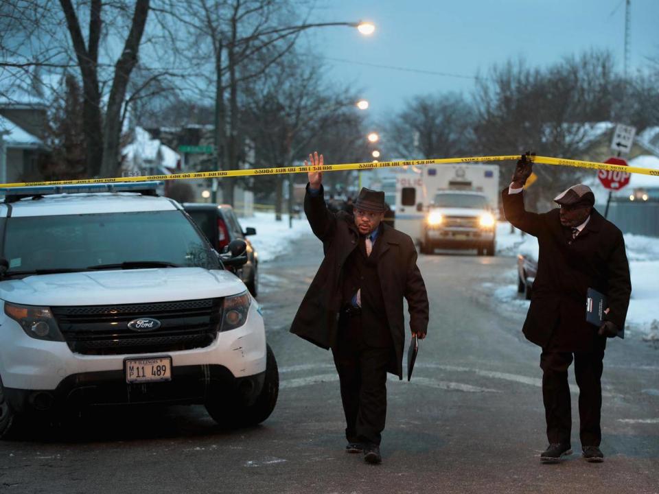 Chicago police investigate the scene of a quadruple homicide on the city's South Side. Chicago had more than 750 homicides in 2016 (Getty)