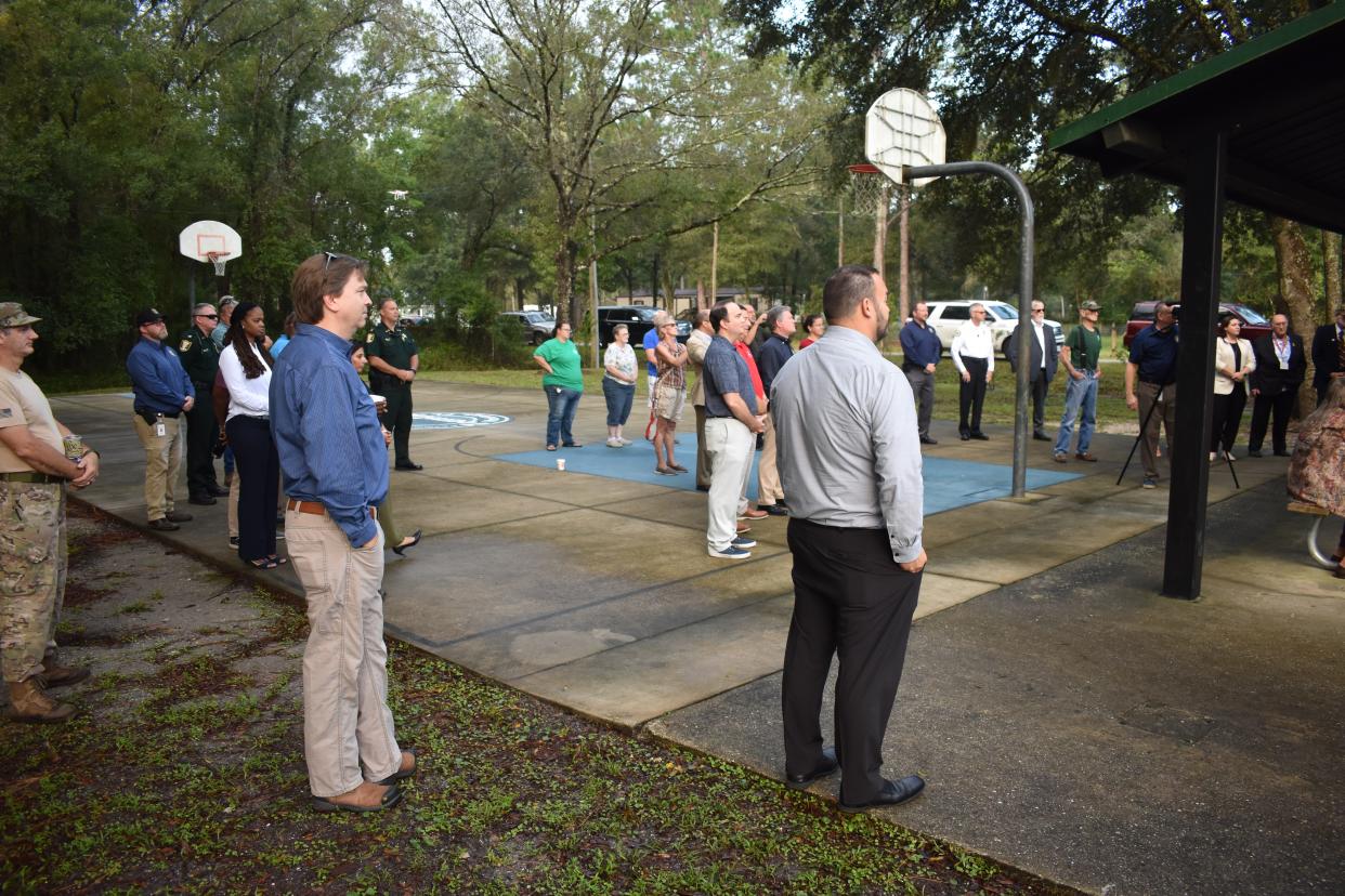 County officials, community members and others gather on Friday morning for the ribbon cutting at the Flagler Estates Community Center.