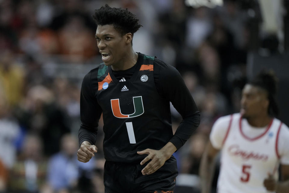 Miami forward Anthony Walker celebrates after scoring against Houston in the first half of a Sweet 16 college basketball game in the Midwest Regional of the NCAA Tournament Friday, March 24, 2023, in Kansas City, Mo. (AP Photo/Charlie Riedel)