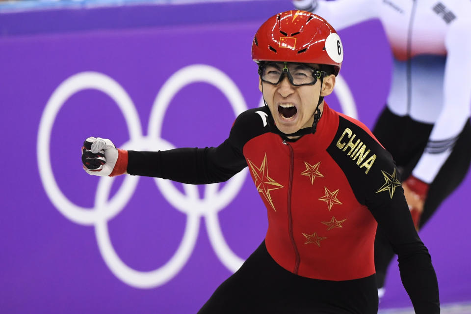 <p>Wu Dajing of China celebrates after winning the Men’s 500m Short Track Speed Skating A Final at the PyeongChang 2018 Winter Olympics in South Korea, on Feb. 22, 2018.<br> (Paul Chiasson/The Canadian Press via AP) </p>