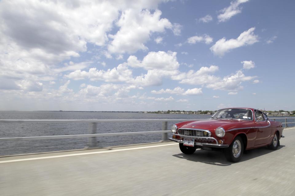 Irv Gordon drives his Volvo P1800 in Babylon, N.Y., Monday, July 2, 2012. Gordon's car already holds the world record for the highest recorded milage on a car and he is less than 40,000 miles away from passing three million miles on the Volvo. (AP Photo/Seth Wenig)