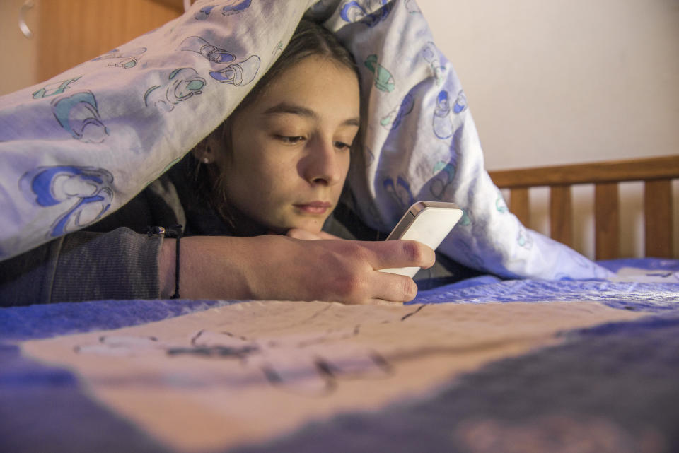 Spending a lot more <i>or</i> a lot less time online all of a sudden could be an indicator of cyberbullying. (Photo: ljubaphoto via Getty Images)