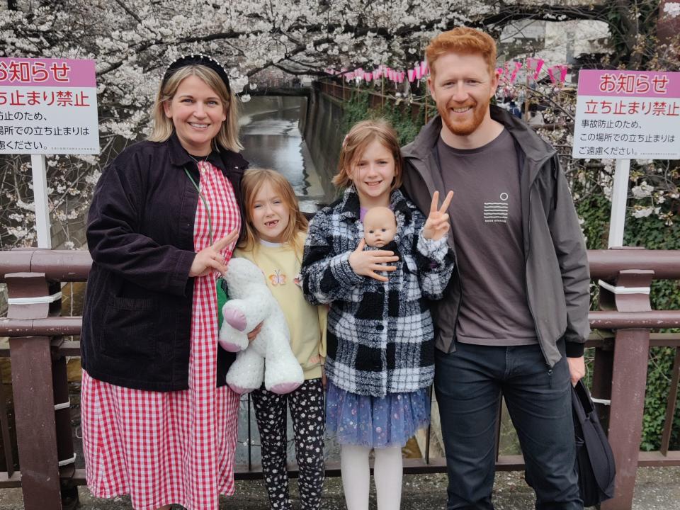 The Ould family pose among some cherry blossoms in Japan.