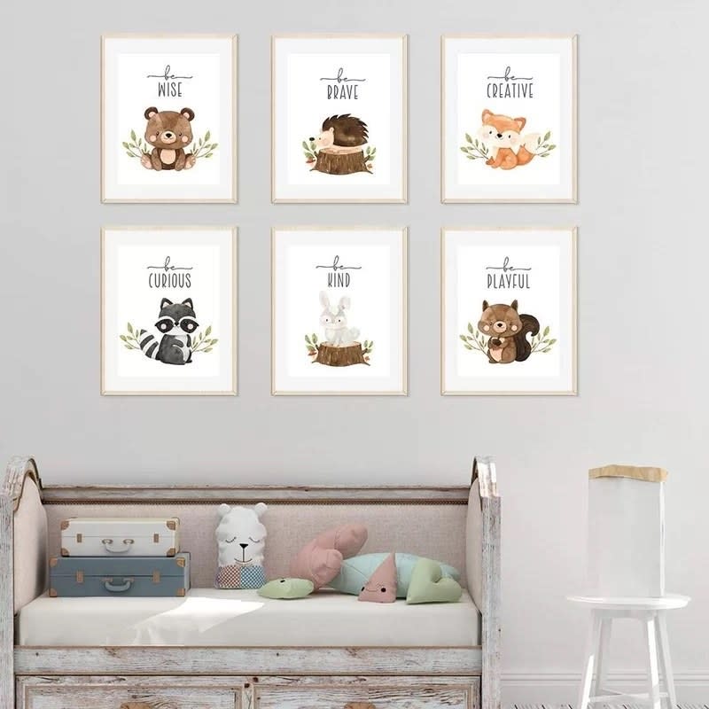 the prints in frames on a wall