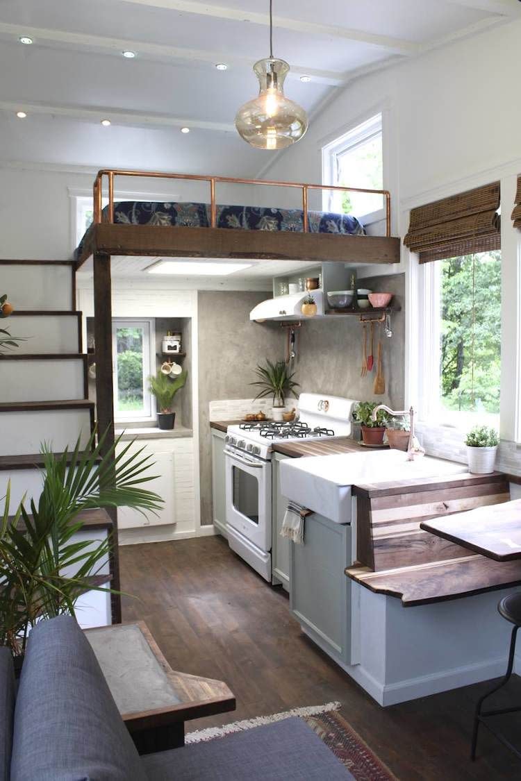 <p>As soon as you walk inside this tiny 250-square-foot home, a tidy and warm escape full of country character greets you. Natural light swims throughout the space, and farmhouse-inspired wood accents (most of which are made from salvaged and reclaimed wood) give it a rustic yet modern touch. </p><p><a class="link " href="https://www.countryliving.com/real-estate/a38780/handcrafted-tiny-house/" rel="nofollow noopener" target="_blank" data-ylk="slk:SEE INSIDE;elm:context_link;itc:0;sec:content-canvas">SEE INSIDE</a></p>