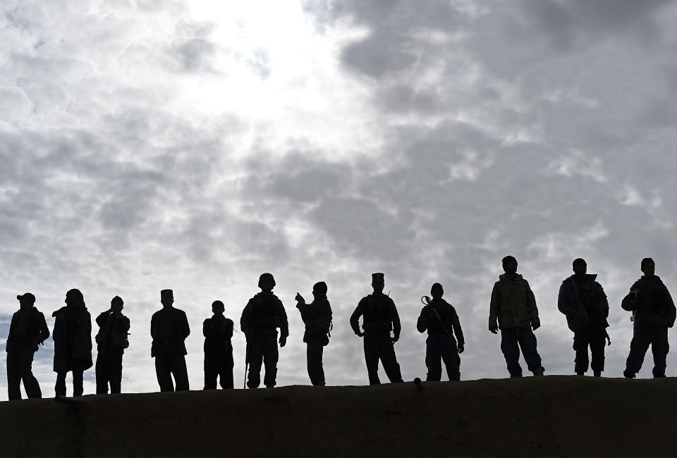 Afghan security forces keep watch during a visit by Afghanistan's Chief Executive Abdullah Abdullah official visit to the Paktika province on Nov. 24, 2014.