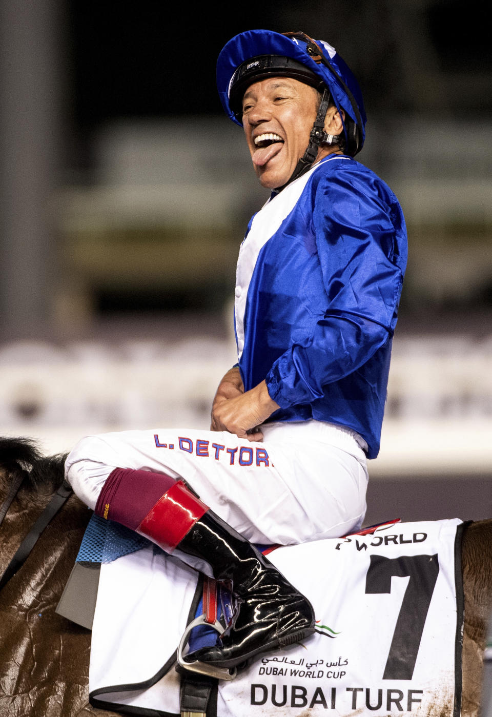 Lord North's jockey Frankie Dettori reacts after winning Group 1 Dubai Turf over 1800m (9 furlongs) at the Meydan racecourse in Dubai, United Arab Emirates, Saturday, March 25, 2023. (AP Photo/Martin Dokoupil)