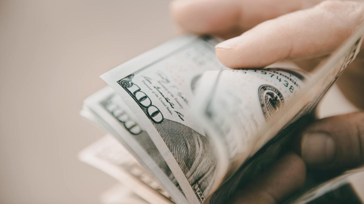 man counting cash money