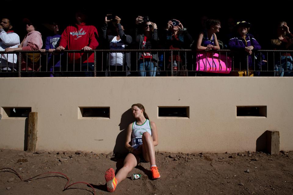 Heritage Christian Academy's Juliana Lundy catches her breath after running in the girls Class 2A cross country state finals at the Norris Penrose Event Center in Colorado Springs, Colo. on Saturday, Oct. 29, 2022.