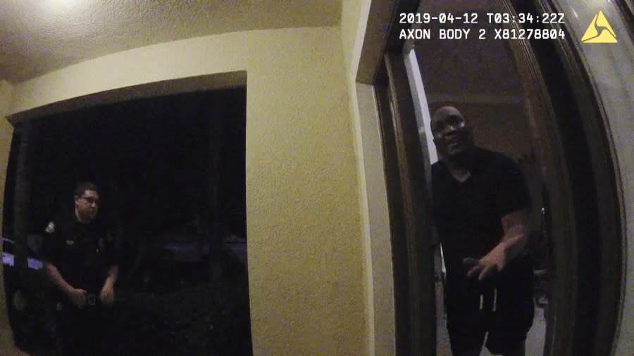 In this image from Ocoee Police Department body-camera video, officers confront Samuel Celestin at the front door of his home in Ocoee, Fla., on April 11, 2019. Celestin was among more than 1,000 people across the United States from 2012 through 2021 who died after police restrained them in ways that are not supposed to be fatal, according to an investigation by The Associated Press in collaboration with FRONTLINE (PBS) and the Howard Centers for Investigative Journalism. (Ocoee Police Department via AP)