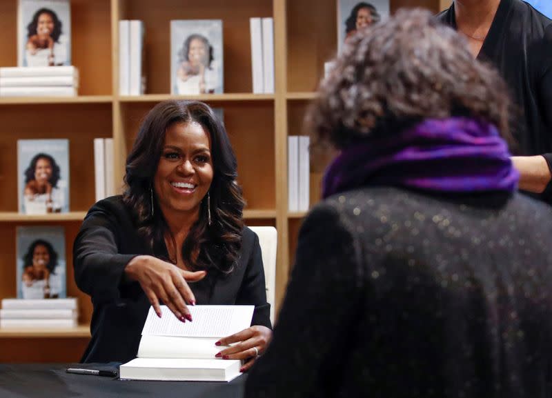 FILE PHOTO: Former first lady Michelle Obama signs copies of her memoir "Becoming" in Chicago