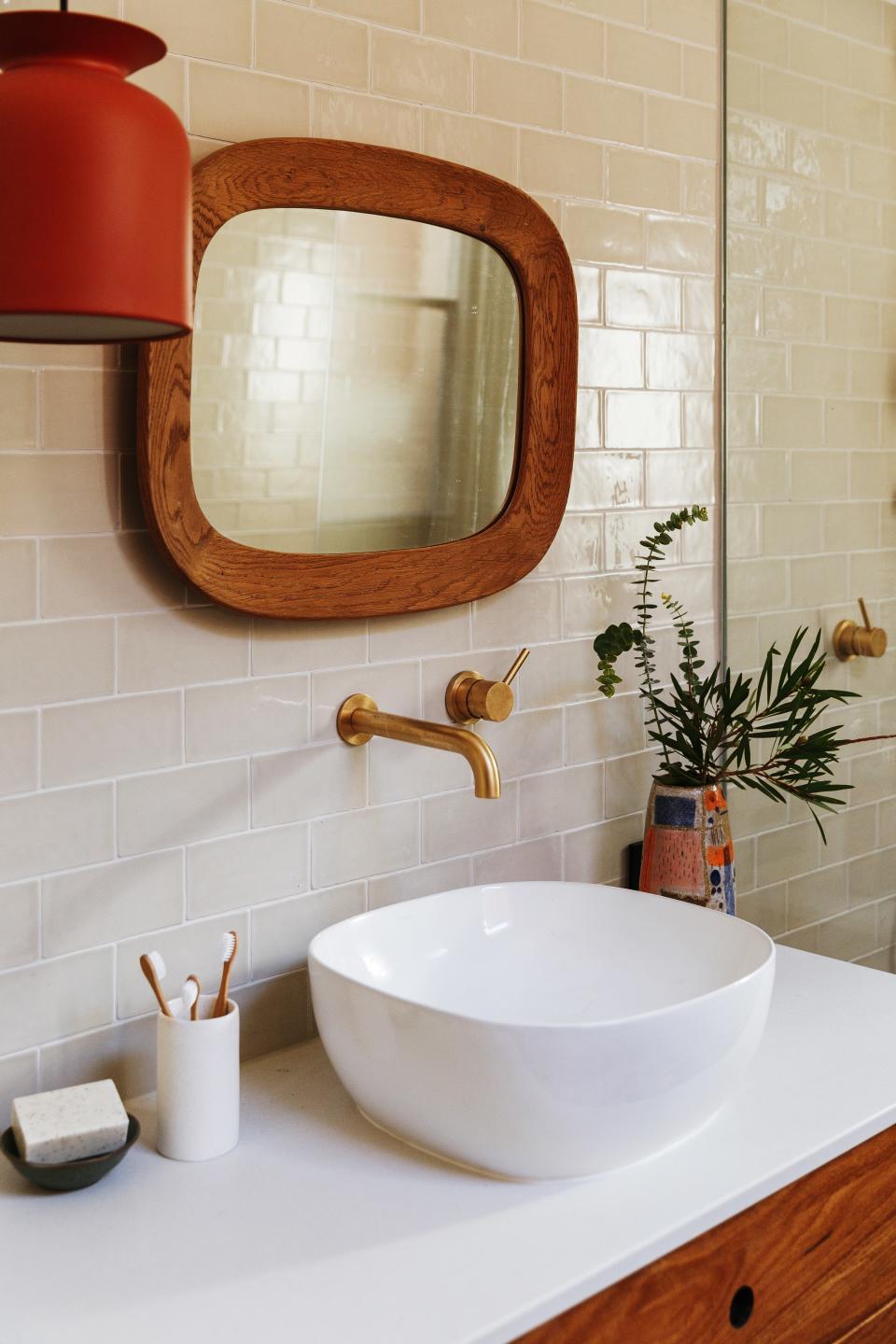 “Amy is a purveyor of textile design, and her bathroom is another extension of her love for pattern,” Kate says. “Of course a pop of red in the pendant punctuated the design and created another playful element.”