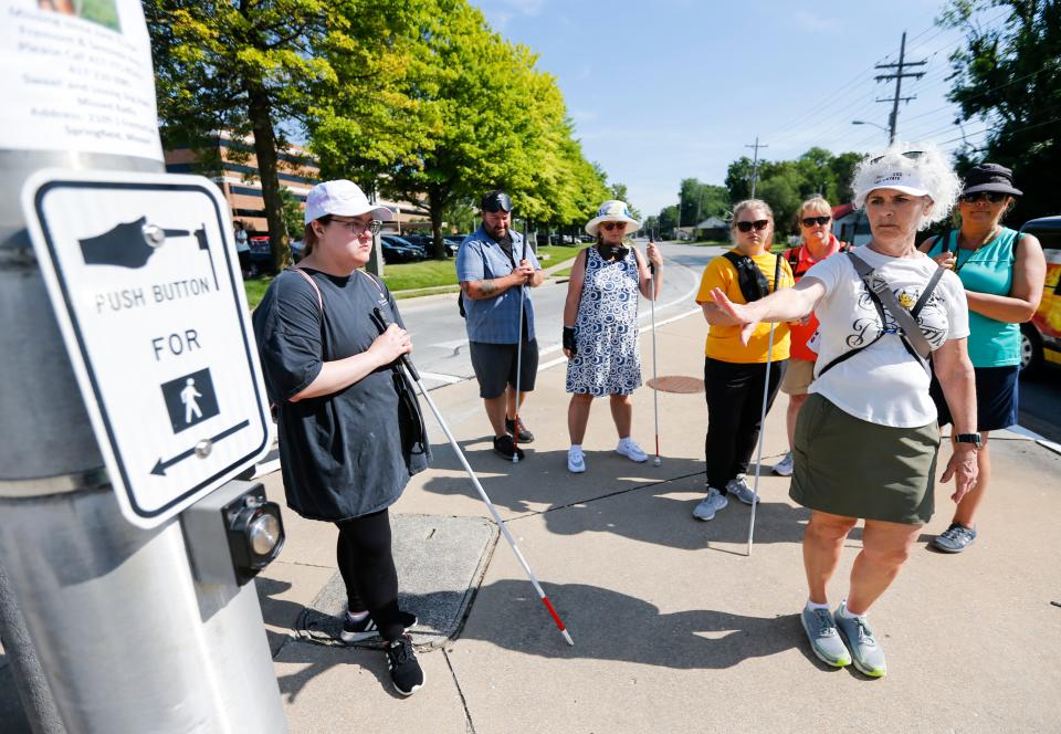 Instructor Reeda Rippee leads a group of students in a Missouri State University Orientation and Mobility Graduate Certificate program course on how to navigate traffic islands with visually impaired and blind students on Tuesday, June 27, 2023.