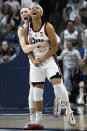 UConn guard Paige Bueckers, left, celebrates with teammate KK Arnold in the second half of a second-round college basketball game in the NCAA Tournament against Syracuse, Monday, March 25, 2024, in Storrs, Conn. (AP Photo/Jessica Hill)