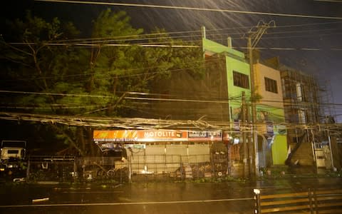 Typhoon Mangkhut slammed into the country's northeastern coast early on Saturday - Credit: Aaron Favila/AP