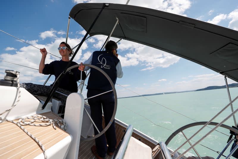 Barczi, member of a boat rental agency, rides a sailing boat on Lake Balaton, following the outbreak of the coronavirus disease (COVID-19), near Balatonfured