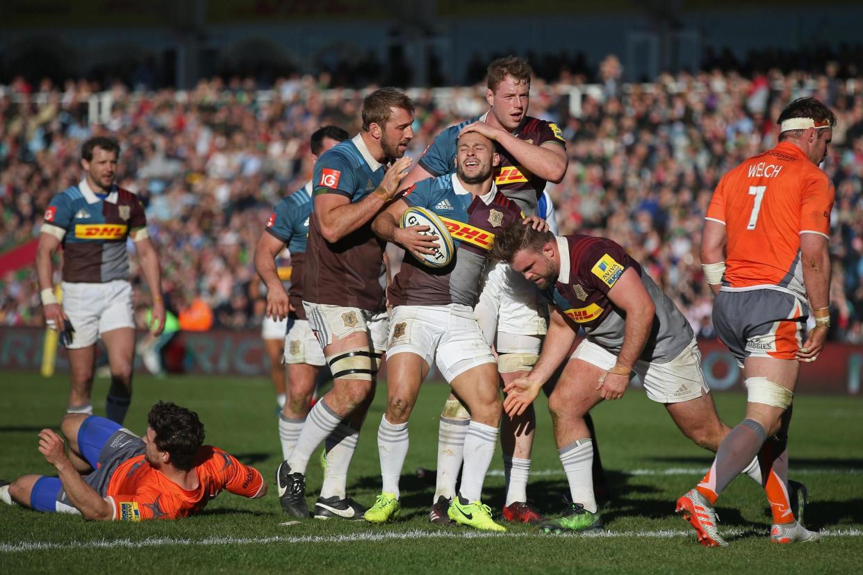Danny Care is congratulated by his team-mates after his try: Getty Images for Harlequins