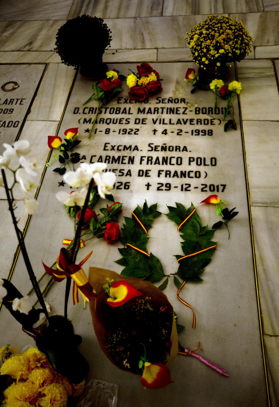 The Franco family burial space is adorned with flowers in the Almudena Crypt, a cavernous late-19th century Catholic temple under Madrid's Almudena cathedral, in central Madrid, Spain, Thursday Oct. 25, 2018. Hundreds of protesters in Madrid are urging government and Catholic church authorities to prevent the remains of the country’s 20th century dictator from ending in the city’s cathedral. Spain’s center-left government has promised to exhume this year Gen. Francisco Franco from a glorifying mausoleum, but the late dictator’s heirs have defied the plans by proposing for his remains to be relocated to a family crypt under the cathedral. (AP Photo/Paul White)