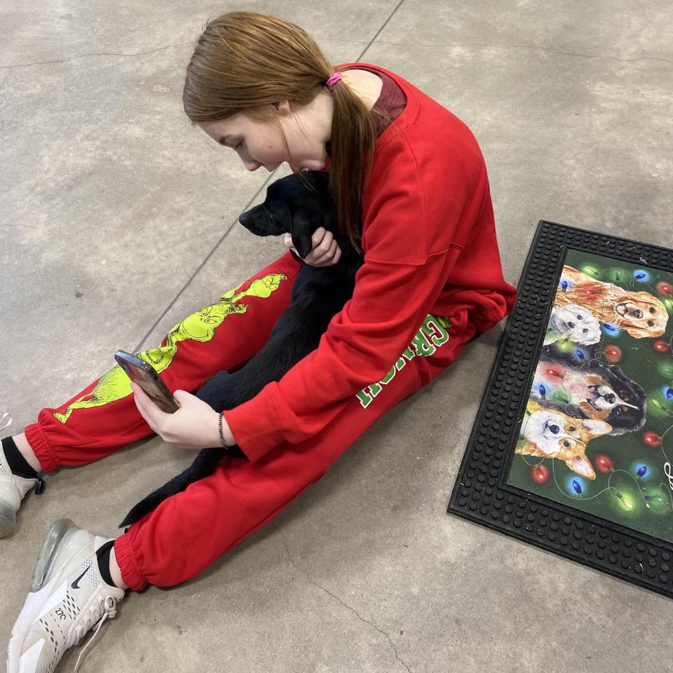 Taryn Brooks with her new dog, Eddie. Eddie gained Internet fame in November 2023 when the Humane Society of Wichita County posted about him, pleading with someone to adopt him because of his fiery personality causing issues at the shelter.