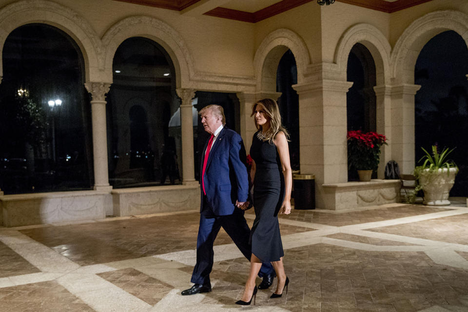 President Donald Trump and first lady Melania Trump arrive for Christmas Eve dinner at Mar-a-lago in Palm Beach, Fla., Tuesday, Dec. 24, 2019. (AP Photo/Andrew Harnik)