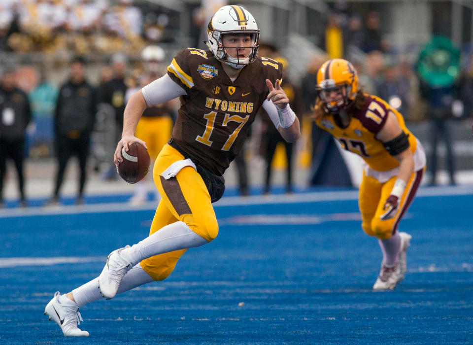 Wyoming quarterback Josh Allen (17) runs with the ball against Central Michigan during the Famous Idaho Potato Bowl NCAA college football game, in Boise, Idaho. (AP)