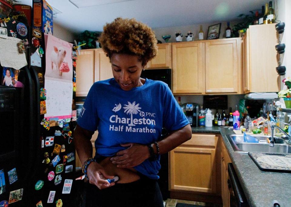 Tralene Williams, a state employee of 18 years, administers an injection of Wegovy on Wednesday, Jan. 31, 2024, in Knightdale, N.C. Leaders of the State Health Plan voted to cut coverage beginning April 1 of all obesity GLP-1 medications, including Wegovy.