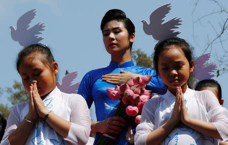 Performers take part during the 50th anniversary of the My Lai massacre in My Lai village, Vietnam March 16, 2018. REUTERS/Kham