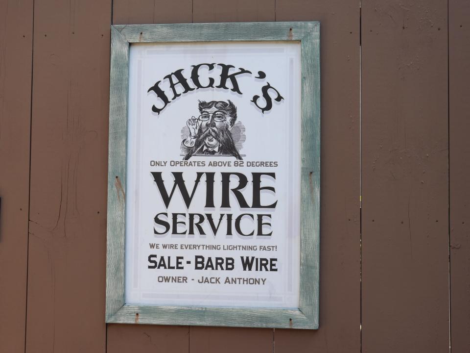 A sign that says "Jack's Wire Service" at Dollywood.