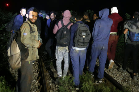 Migrants are stopped by the border police while trying to cross the Bosnian border from Serbia, near Zvornik, Bosnia and Herzegovina September 1, 2018. REUTERS/Dado Ruvic