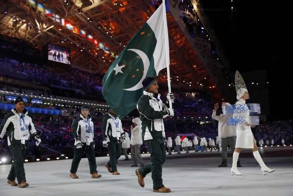 Pakistan's flag-bearer Muhammad Karim leads his country's contingent during the athletes' parade at the opening ceremony of the 2014 Sochi Winter Olympics, February 7, 2014. REUTERS/Jim Young (RUSSIA - Tags: OLYMPICS SPORT)