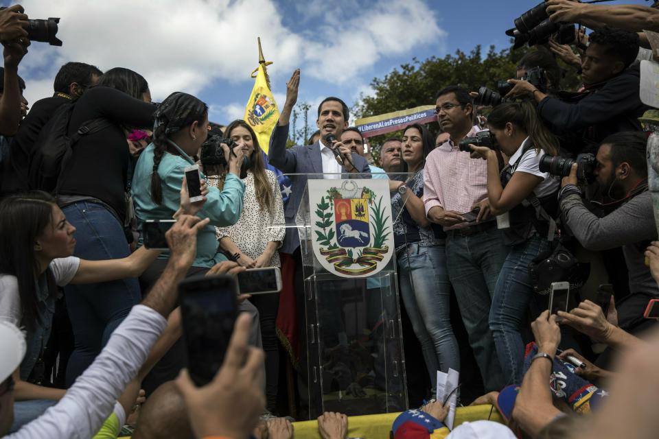 Venezuela's self-declared interim leader Juan Guaido speaks to supporters during a gathering to propose amnesty laws for police and military, at a public plaza in Las Mercedes neighborhood of Caracas, Venezuela, Saturday, Jan. 29, 2019. Venezuela's political showdown moves to the United Nations where a Security Council meeting called by the United States will pit backers of President Nicolas Maduro against the Trump administration and supporters of Guaido. (AP Photo/Rodrigo Abd)