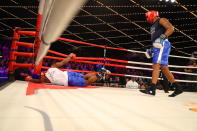 <p>Kevon Sample (blue) knocks down Larry Carson (red) in the LT Rumble Match at the NYPD Boxing Championships at Madison Square Garden’s Hulu Theater on March 15, 2018. (Gordon Donovan/Yahoo News) </p>