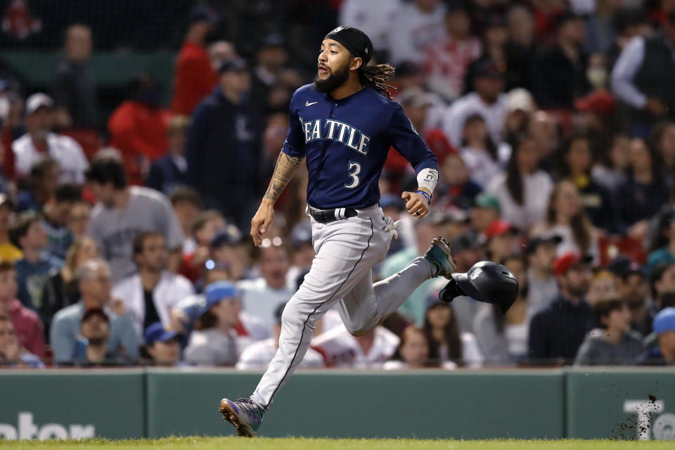 Seattle Mariners' J.P. Crawford scores on a single by Jesse Winker against the Seattle Mariners during the eighth inning of a baseball game Friday, May 20, 2022, in Boston. (AP Photo/Michael Dwyer)