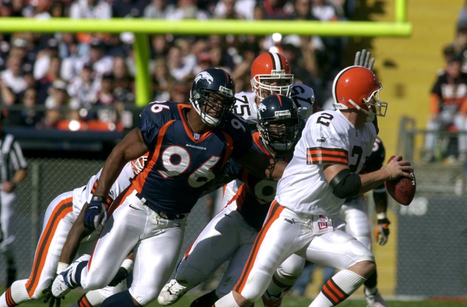 Broncos lineman Harald Hasselbach attempts to chase down Browns quarterback Tim Couch. (Photo By Hyoung Chang/The Denver Post via Getty Images)