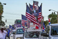 In this Oct. 10, 2020 photo, a caravan supporting President Trump drives around Miami streets. Florida's Cuban American voters remain a bright spot in Trump's effort to retain his winning coalition from 2016. Polls show his strong support from these key voters may even be growing to include the younger Cuban Americans that Democrats once considered their best hope of breaking the GOP's hold. (Pedro Portal/Miami Herald via AP)