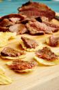 <p>Make meat and potatoes the cocktail-hour way by serving <a href="https://www.delish.com/holiday-recipes/hanukkah/g3096/hanukkah-brisket-recipes/" rel="nofollow noopener" target="_blank" data-ylk="slk:brisket;elm:context_link;itc:0;sec:content-canvas" class="link ">brisket</a> over potato chips. We prefer thick-cut ridged chips, but any hearty chip will do.<br></p><p>Get the <strong><a href="https://www.delish.com/cooking/recipe-ideas/recipes/a44875/brisket-bites-recipe/" rel="nofollow noopener" target="_blank" data-ylk="slk:Brisket Bites recipe;elm:context_link;itc:0;sec:content-canvas" class="link ">Brisket Bites recipe</a></strong>.</p>